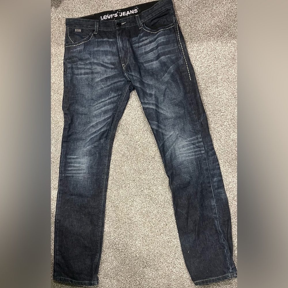 Levi's Men's Dark Wash Jean Brand New! No signs of wear. Measurements in photos